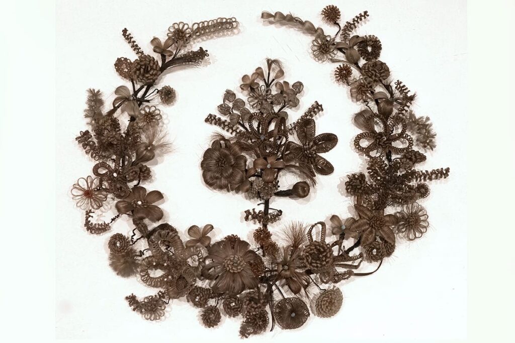 A large, circular piece of hair art from the 1860s